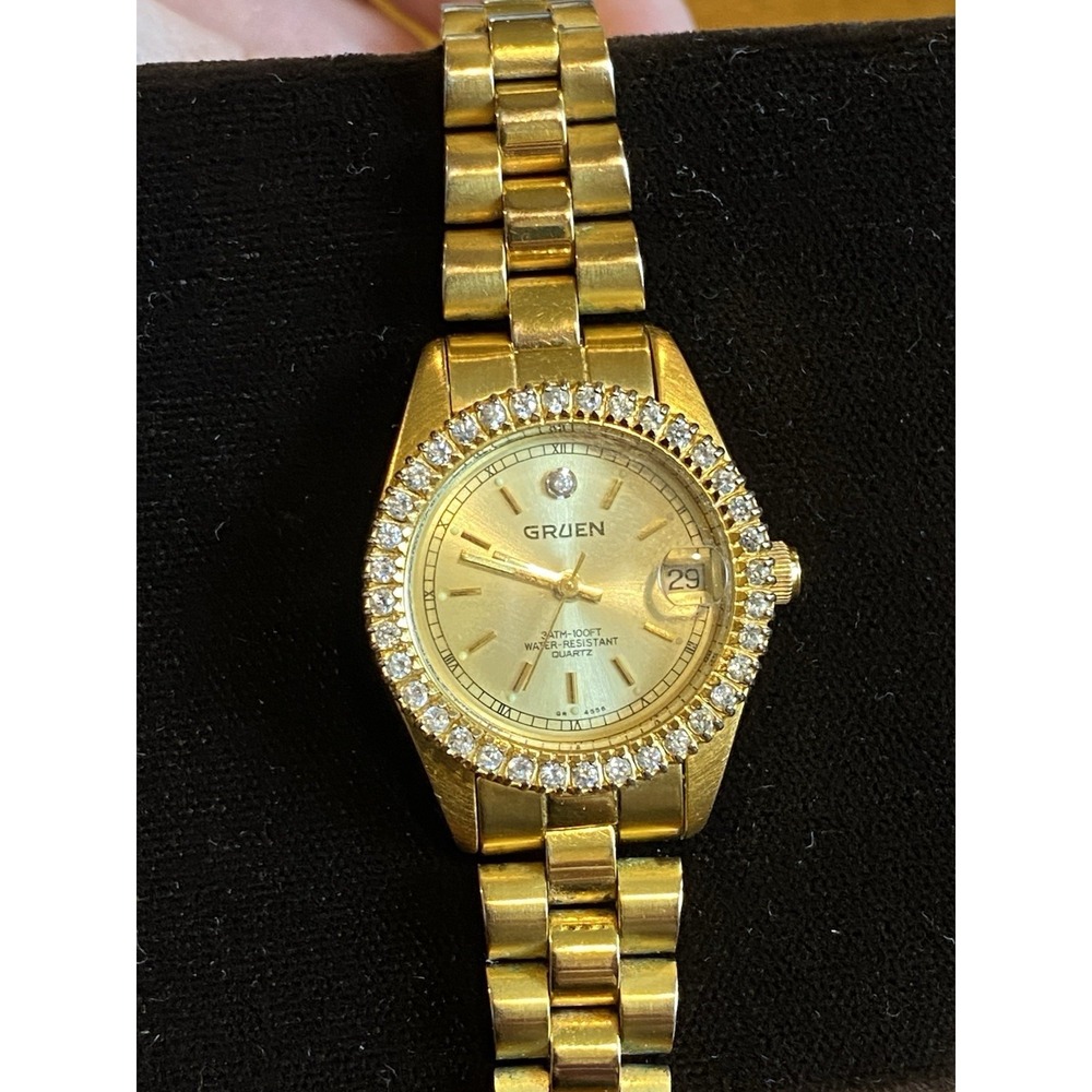 Gruen Precision Gold Tone Round Cubic Zirconia Bezel Date Watch 237.803.114